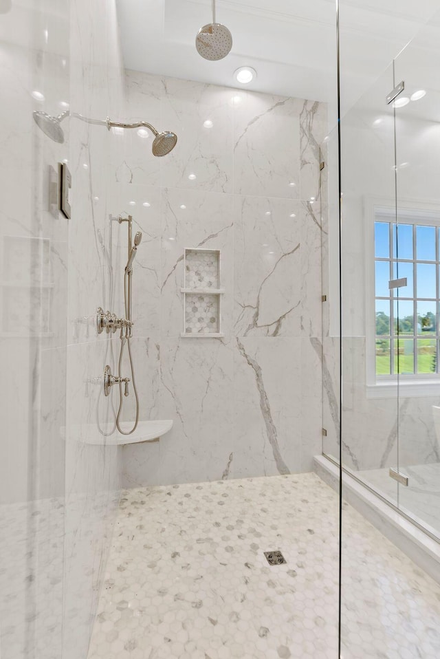 bathroom with a shower with shower door