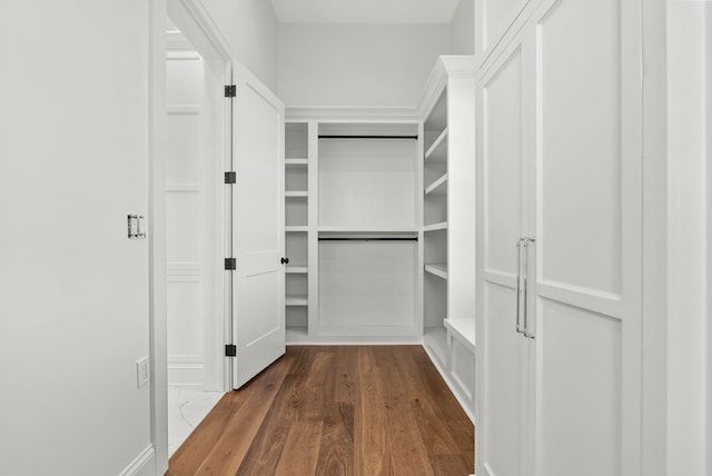 walk in closet featuring dark hardwood / wood-style flooring