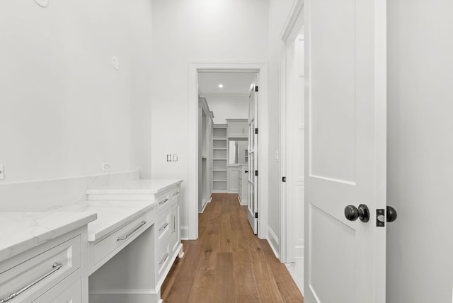 corridor featuring light hardwood / wood-style floors