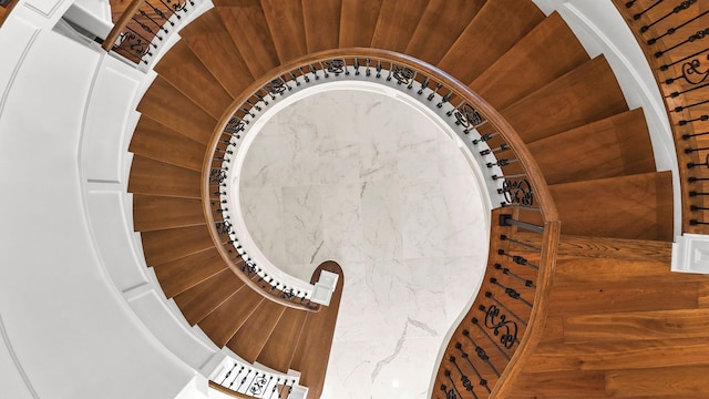 stairs featuring wood walls