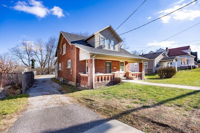 bungalow with a porch and a front yard