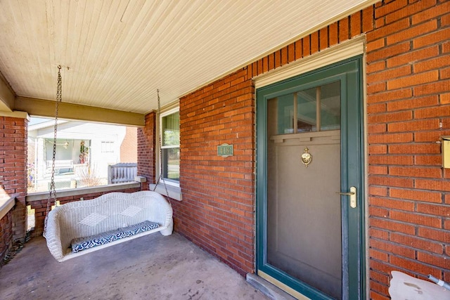 entrance to property featuring covered porch