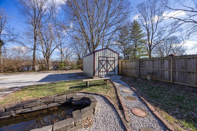 view of yard featuring a fire pit and a storage unit