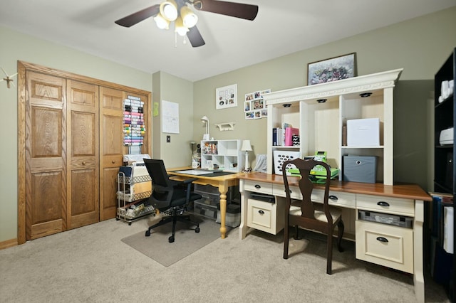 carpeted office with ceiling fan