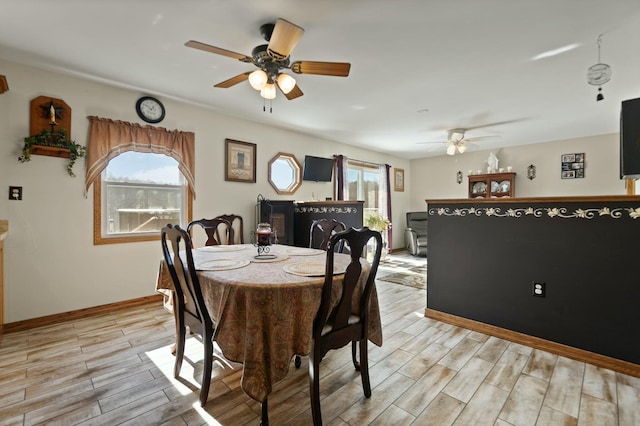 dining area featuring ceiling fan and a healthy amount of sunlight