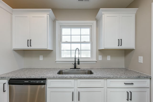 kitchen with white cabinetry, dishwasher, sink, and light stone countertops