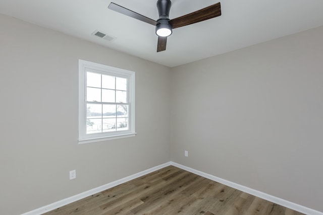 empty room featuring wood-type flooring and ceiling fan