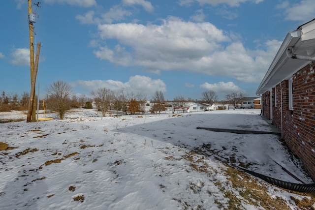 view of yard covered in snow