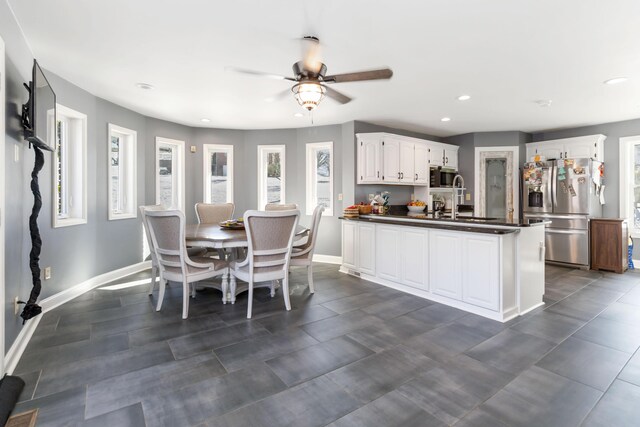 kitchen with sink, ceiling fan, white cabinets, and appliances with stainless steel finishes