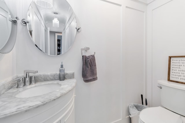 bathroom with vanity and toilet