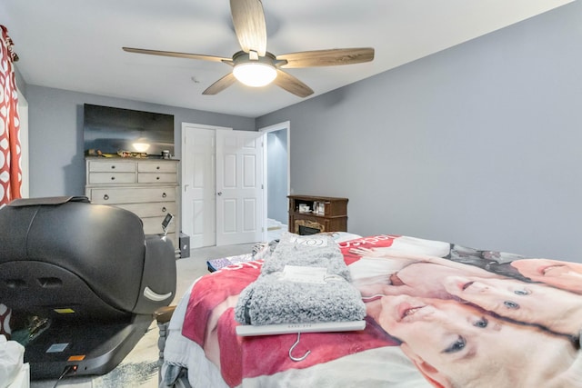 bedroom with ceiling fan and a closet