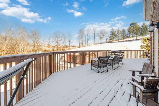 view of snow covered deck