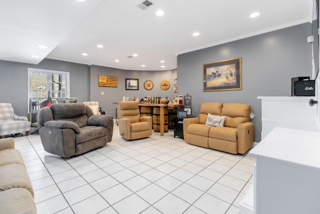 living room featuring crown molding and light tile patterned flooring