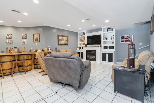 tiled living room with crown molding and built in features