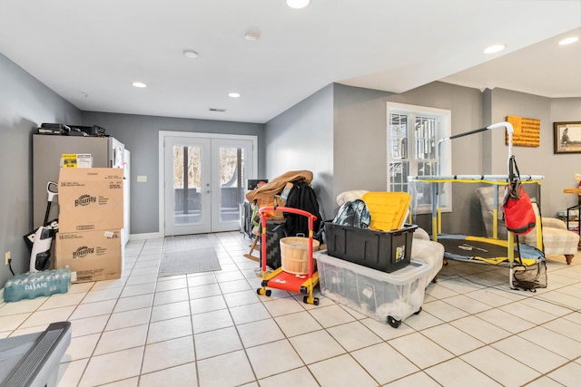 rec room featuring light tile patterned floors and french doors