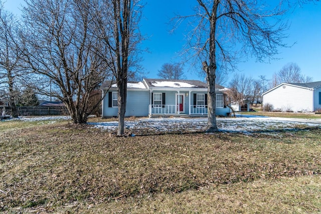 single story home featuring a porch and a front lawn