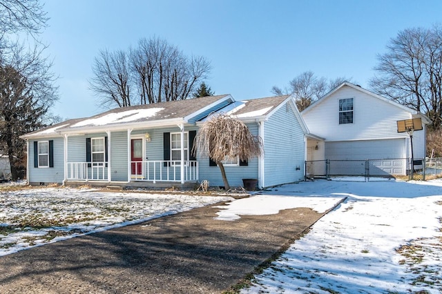 view of front of home featuring a garage and covered porch