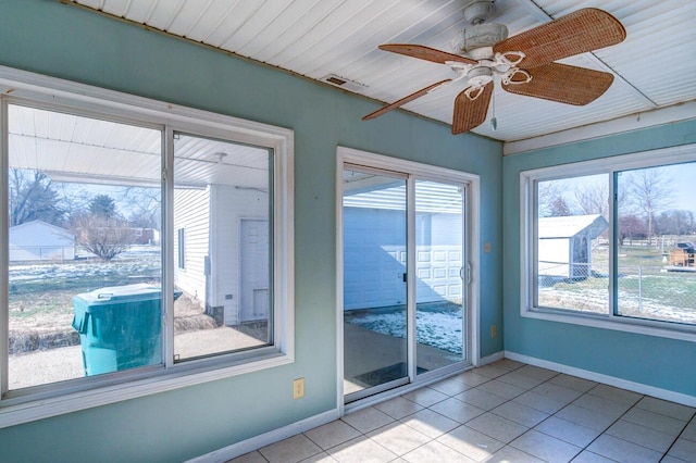 interior space featuring ceiling fan and a healthy amount of sunlight