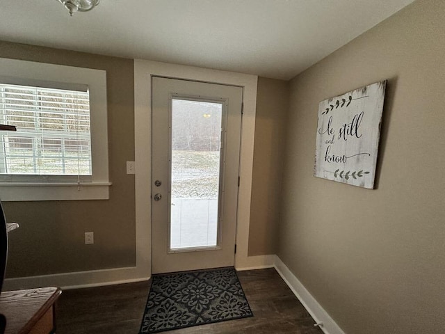 entryway with dark hardwood / wood-style floors