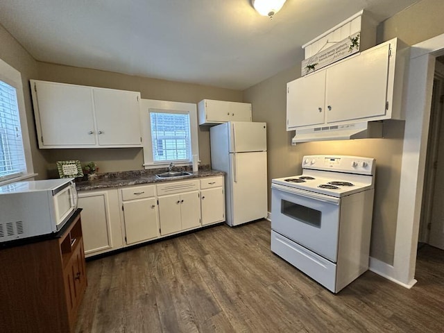 kitchen with white appliances, dark hardwood / wood-style floors, sink, and white cabinets