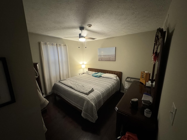 bedroom with a textured ceiling and ceiling fan