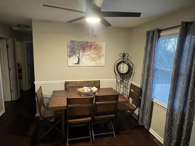 dining area featuring dark hardwood / wood-style flooring and ceiling fan