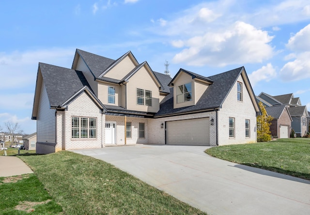 view of front of property featuring a garage and a front yard