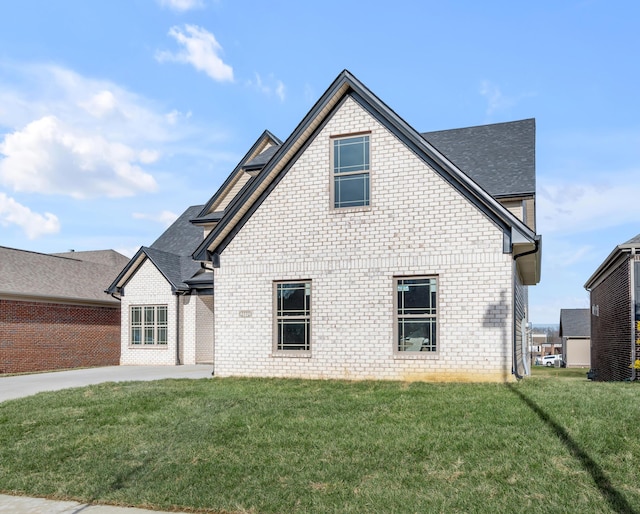 view of side of property featuring a yard