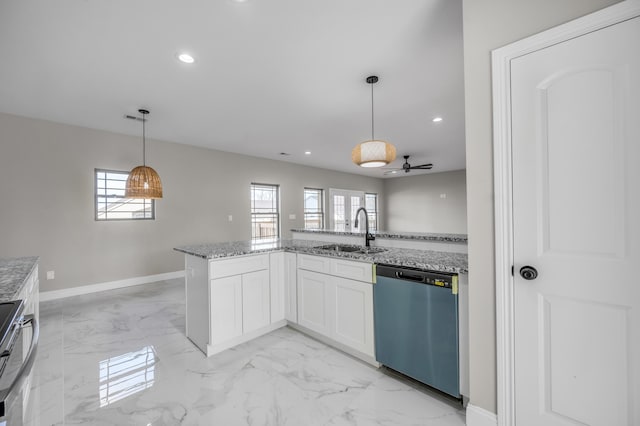 kitchen featuring sink, white cabinetry, hanging light fixtures, light stone countertops, and stainless steel dishwasher