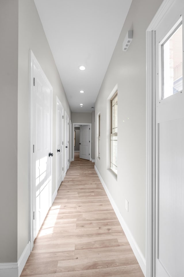 corridor featuring light hardwood / wood-style floors