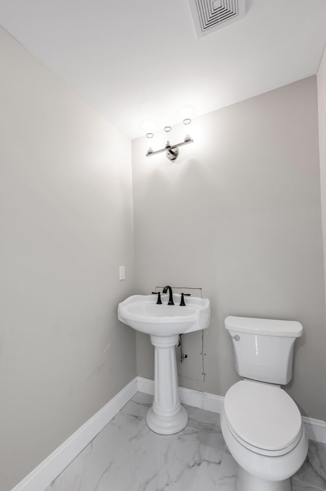 bathroom featuring toilet