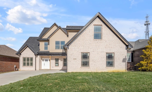 view of front of home with a front lawn and a patio area