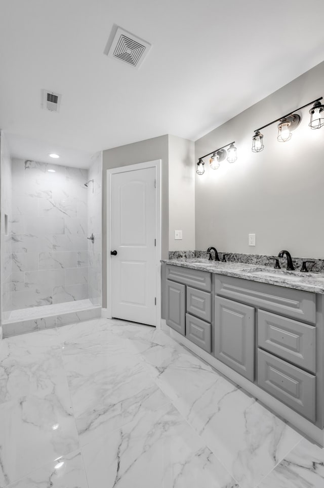 bathroom featuring vanity and a tile shower