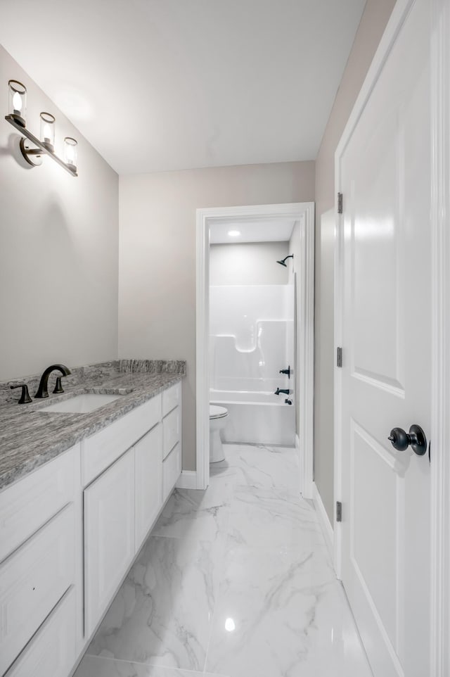 full bathroom with toilet, vanity, and shower / washtub combination