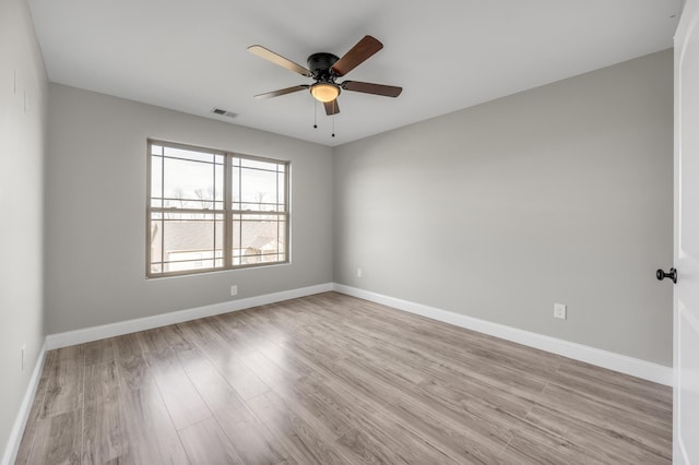 unfurnished room with light hardwood / wood-style flooring and ceiling fan