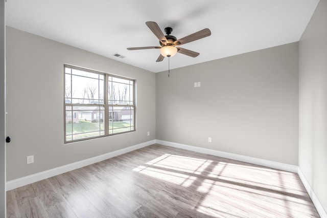 unfurnished room featuring ceiling fan and light hardwood / wood-style floors