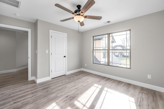 unfurnished bedroom featuring ceiling fan and light hardwood / wood-style flooring