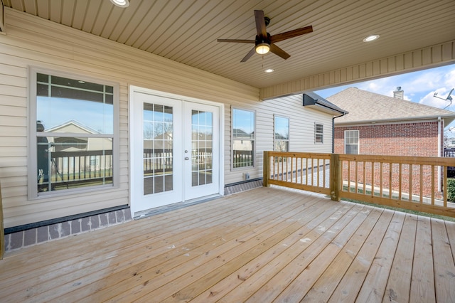 wooden deck featuring french doors and ceiling fan