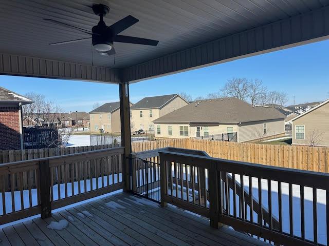 wooden terrace featuring ceiling fan