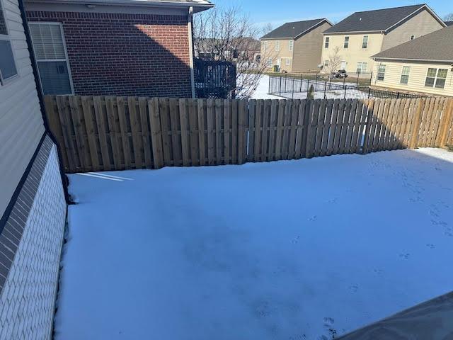 view of yard covered in snow