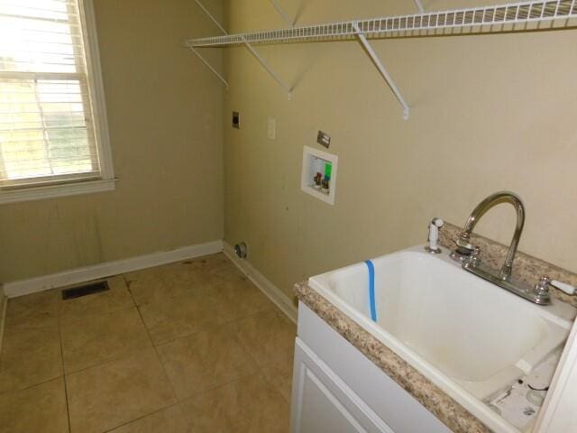 laundry area featuring washer hookup, light tile patterned floors, and hookup for an electric dryer