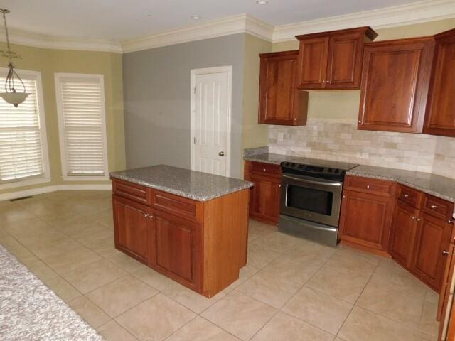 kitchen with ornamental molding, light stone countertops, stainless steel range with electric cooktop, and decorative light fixtures