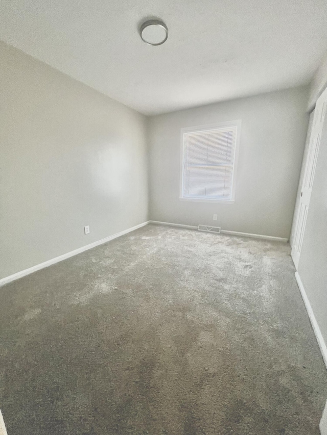 empty room featuring carpet flooring