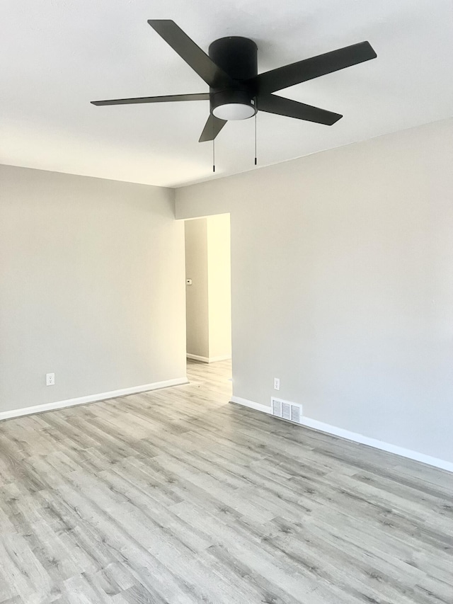 unfurnished room featuring ceiling fan and light hardwood / wood-style flooring