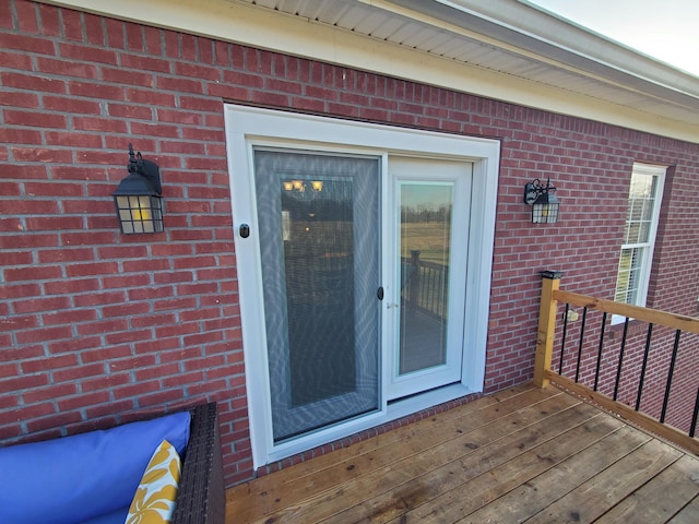 doorway to property with a deck