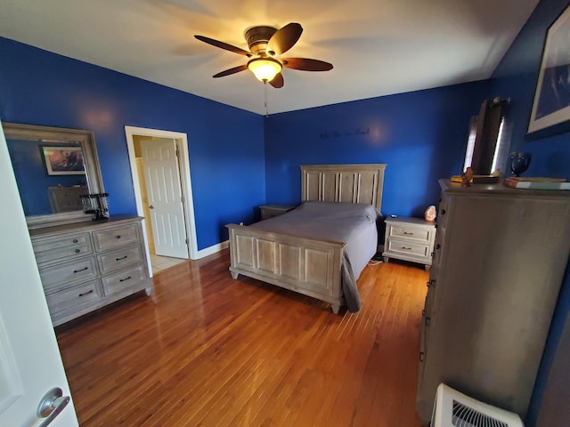 bedroom featuring hardwood / wood-style flooring and ceiling fan