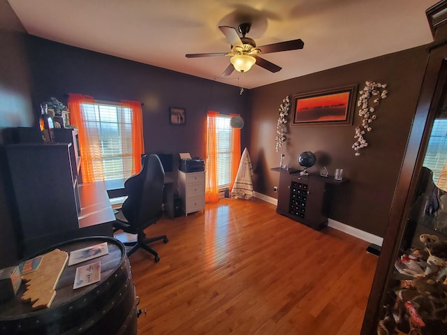 office space featuring wood-type flooring and ceiling fan