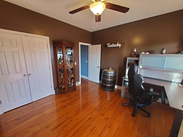 office featuring wood-type flooring and ceiling fan