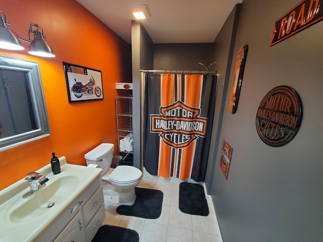 bathroom featuring walk in shower, tile patterned floors, vanity, and toilet