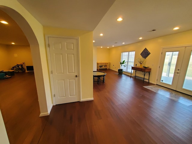 foyer entrance with dark hardwood / wood-style flooring and french doors